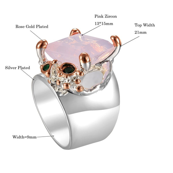 The Pink Dusk Ring has tiny green zircons. Made of copper, rose gold plated. Abstract, modern design. Has a shine finish. Rectangle cut in a prong setting. 