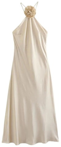 The Zara Satin Beige Halter Dress is elegant, smooth and silky crafted & from satin feel fabric. Its halter neck has a sculptured rose centrepiece, bias cut, backless and midi length.