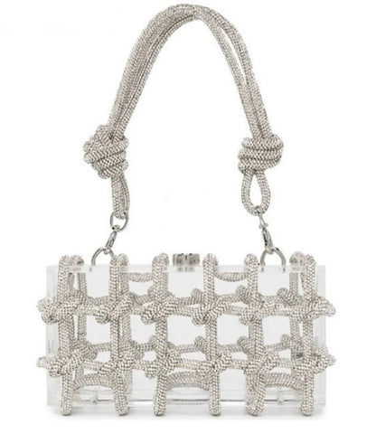 The Herra Rope Box Clutch is a clear acrylic box clutch, wrapped in knotted glitter rope. Finished with crystalline shaped clasp. Bag suitable for any special occassion.