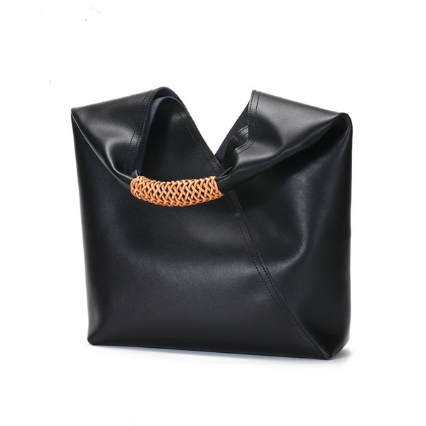 This Bucket Soft Slouch Tote is a beautiful and useful real cow leather slouch shoulder bag. With perforated seude hand strap. Artful, purposeful and lined tote. 