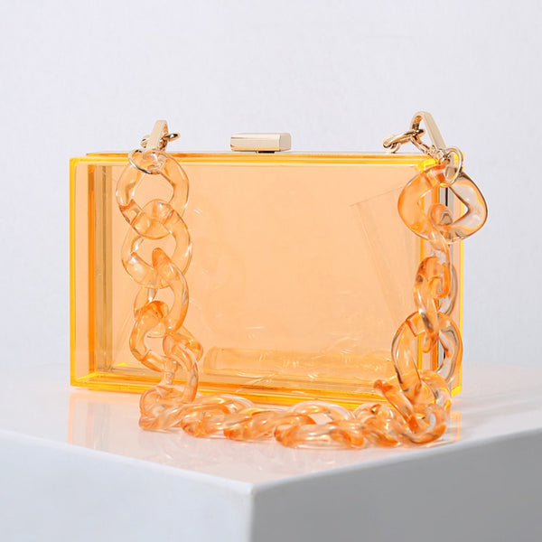 This Clear Colored Clutch Purse is an acrylic transparent box clutch. Being clear allows visibility to your mobile, glasses, lipstick, mirror. Both beautiufl and functional.