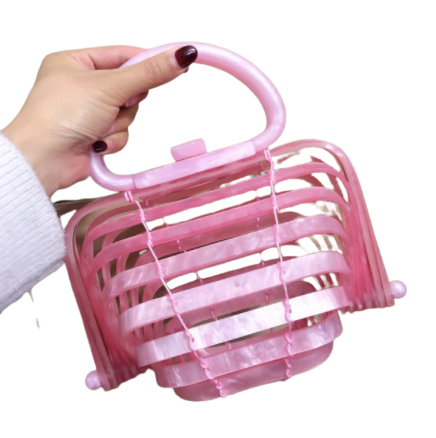 Eva Basket Bag is a multi hued, woven basket purse is perfect for summer. A unique folding bag with a clasp, single handle. It's perfect, pretty and  lightweight.