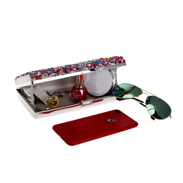 Colourfully tactile, the Ocean Candy Clutch Purse is sprinkled and coated with colored tiny acrylic crystals, stones, gemstones, beads and shells. With crossbody silver chain. 