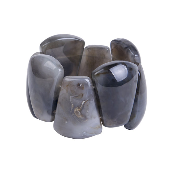 The stretch Resin Cuff Bracelet is a beaded, angular 50s retro bracelet that stretches to fit any hand. Elasticated for easy wear. Each bead is irregular and coloured both sides.