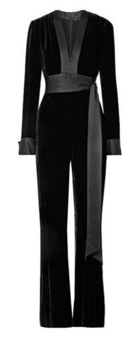 The Charlie Black Velvet Jumpsuit is a svelte choice for evenings out with a floor silhouette. The long-sleeved style offers a deep V neckline, a large side sash wrap bow. 