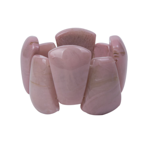 The stretch Resin Cuff Bracelet is a beaded, angular 50s retro bracelet that stretches to fit any hand. Elasticated for easy wear. Each bead is irregular and coloured both sides.