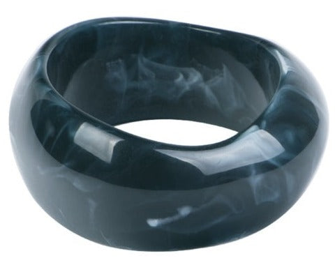 This Geometric Large Resin Bangle is perfect for making a statement. The design features a unique geometric shape. Constructed from high-quality, colored resin.
