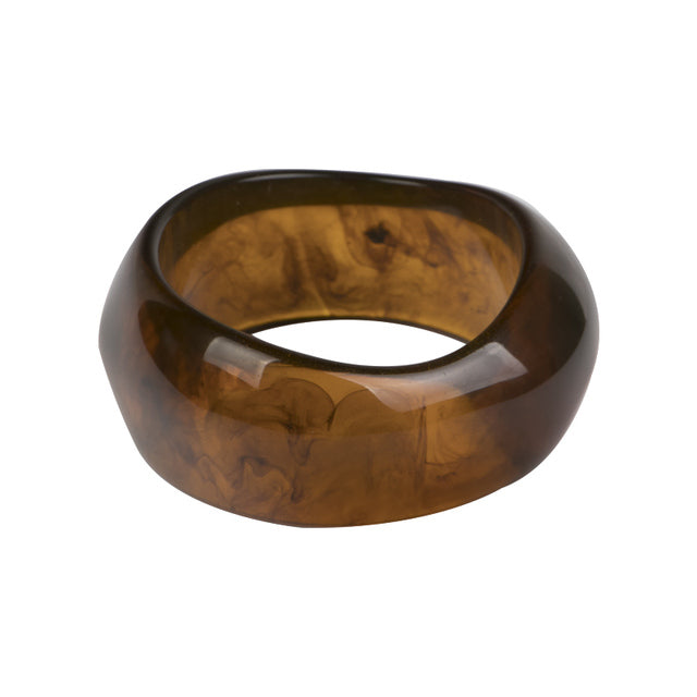 This Geometric Large Resin Bangle is perfect for making a statement. The design features a unique geometric shape. Constructed from high-quality, colored resin.