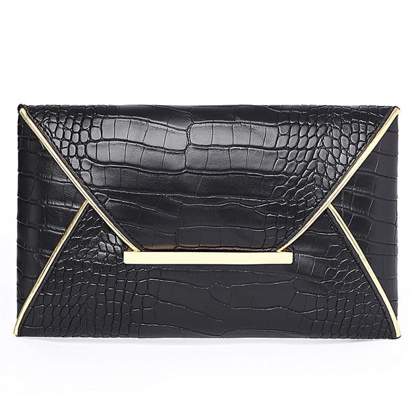 The Snake Pattern Envelope Clutch Sis a flat, lined envelope clutch bag with colored alligator snake pattern. Magnetic metal tab closure. In 100 Percent PU eco leather.