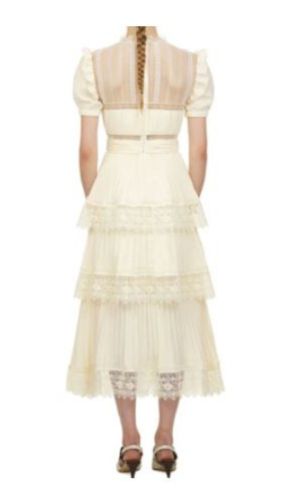 Sheer Lila Short Sleeve Ruffle Dress. Crafted with delicate lace and ruffles. The delicate fabric is soft and comfortable to wear. Lace vintage summer dress in off-white.