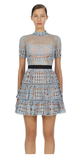 Sweet Briar Little Blue Dress is fully lined with a black ribbon waistband. The dress which is floral embroidered lace, has a mini A-line skirt with three layered frills