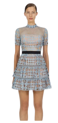 Sweet Briar Little Blue Dress is fully lined with a black ribbon waistband. The dress which is floral embroidered lace, has a mini A-line skirt with three layered frills