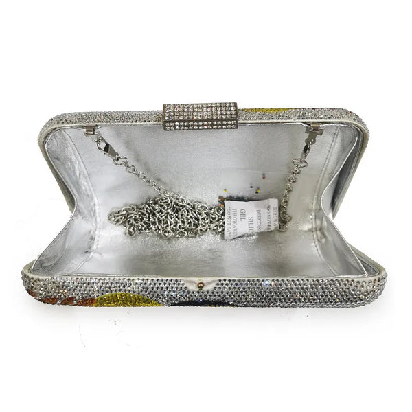 The Crystal Bird Clutch Purse is an mmbellished toucan parot clutch purse, covered with tiny colored crystal rhinestones. Finished with detail clasp closure.