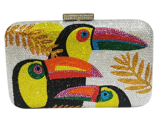 The Crystal Bird Clutch Purse is an mmbellished toucan parot clutch purse, covered with tiny colored crystal rhinestones. Finished with detail clasp closure.