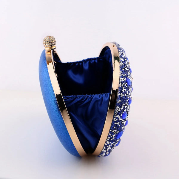 Sparkling oval rhinestone beaded clutch bag with glitter finish, clasp closure & chain strap. Perfect for weddings, prom, parties & evening events.