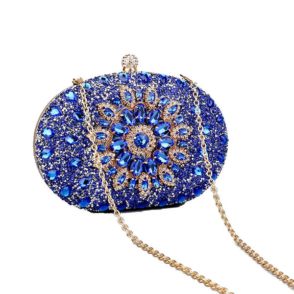 Sparkling oval rhinestone beaded clutch bag with glitter finish, clasp closure & chain strap. Perfect for weddings, prom, parties & evening events.