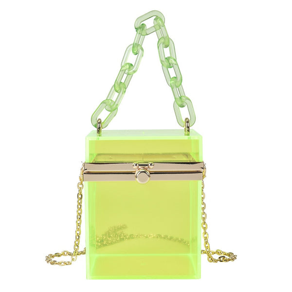 Transparent square shaped box hand bag. In gorgeous colored acrylic. With acrylic hand chain & removeable crossbody silver chain. Special lock clasp. Including lilac, smoky black, clear and neon green.