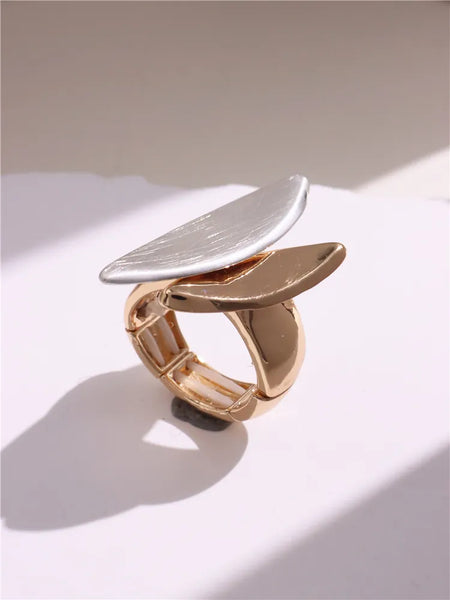 Light Large Silver and Gold Geometric Ring comes in a variety of shapes and designs. Crafted with titanium steel and a contemporary geometric design. One size.