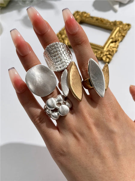 Light Large Silver and Gold Geometric Ring comes in a variety of shapes and designs. Crafted with titanium steel and a contemporary geometric design. One size.