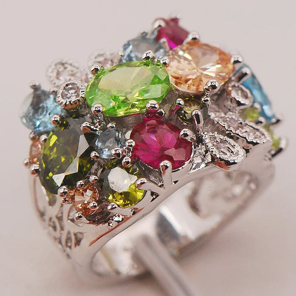 This Aquamarine Morganite Peridot Zircon Ring features a breathtaking combination of three gemstones: aquamarine, morganite, and peridot. Presenting a ring with color and sparkle.