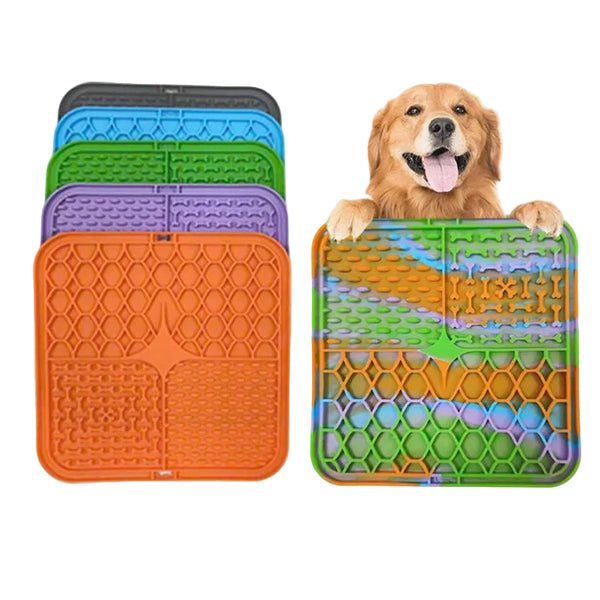 Set of colorful silicone mats with a dog playfully interacting with one of them on a white background.