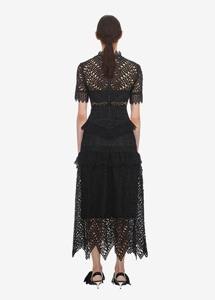 Mana Dress textured lace. Short sleeves front neckline framed with lace mandarin collar. The lined skirt has features a hand-cut, raw lace zig zag scallop hemline. 