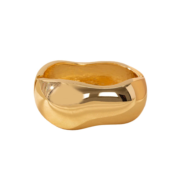 This large bangle bracelet features a striking geometric design in silver and gold tones, offering a modern and versatile accessory for any outfit. 