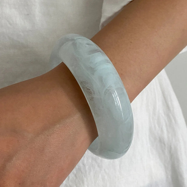 Silver, Orange, Light Blue, Gold and Clear Geometric Bangle perfect for making a statement. The design features a unique geometric shape. Constructed from high-quality resin &amp; zinc alloy that is lightweight and durable