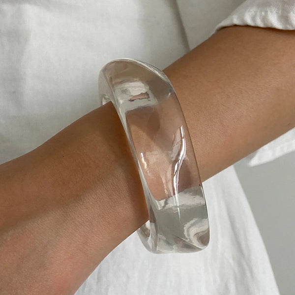 Silver, Orange, Light Blue, Gold and Clear Geometric Bangle perfect for making a statement. The design features a unique geometric shape. Constructed from high-quality resin &amp; zinc alloy that is lightweight and durable