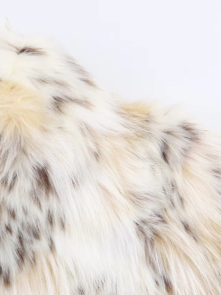 Snow Leopard Faux Fur Jacket stylised for you. Warm, lined jacket with a lapel collar and long sleeves. Front pockets. Faux fur in cream, beige and white with distinction animal print marks and appliqué detail. 