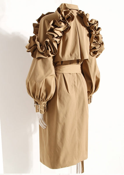 This has to be the ultimate trench coat. It has mulitple frill pleats, that fan out and cascades down both arms. Nothing can stand next to this piece of art. In Black & Hazelnut.