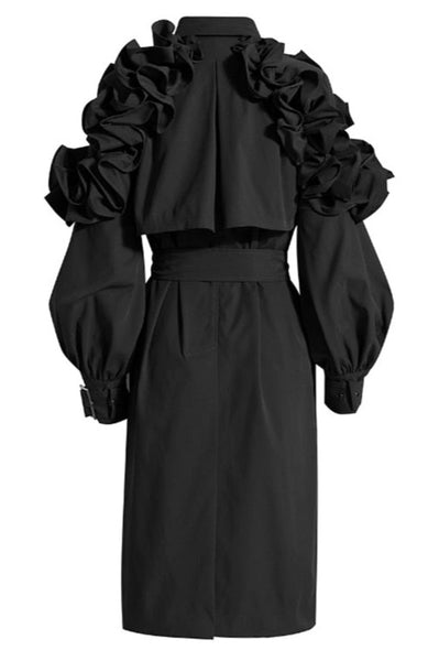 This has to be the ultimate trench coat. It has mulitple frill pleats, that fan out and cascades down both arms. Nothing can stand next to this piece of art. In Black & Hazelnut.