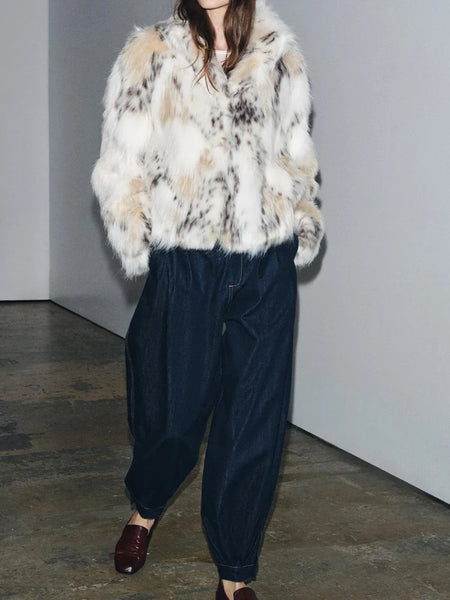 Snow Leopard Faux Fur Jacket stylised for you. Warm, lined jacket with a lapel collar and long sleeves. Front pockets. Faux fur in cream, beige and white with distinction animal print marks and appliqué detail. 