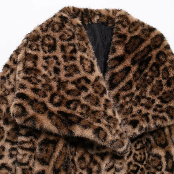 Henna Cropped Leopard Faux Fur Jacket in chocolate brown and tan. Warm, lined jacket with a lapel collar and long sleeves. Faux fur with distinction animal print and speckle detail.