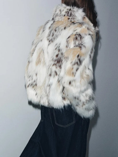 Snow Leopard Faux Fur Jacket stylised for you. Warm, lined jacket with a lapel collar and long sleeves. Front pockets. Faux fur in cream, beige and white with distinction animal print marks and appliqué detail. 