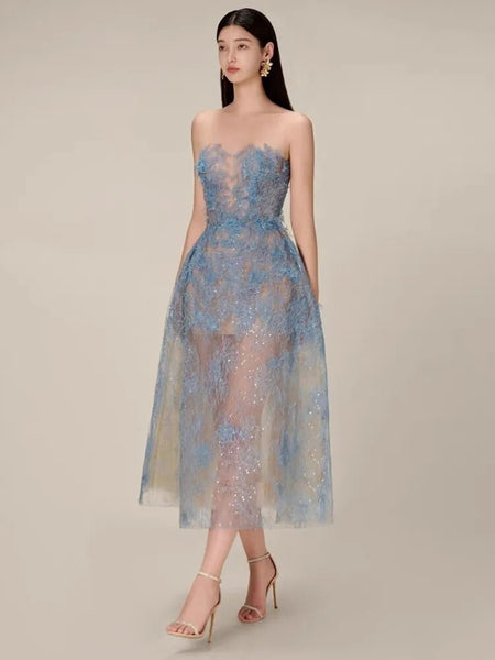 The Khloe Fine Lace Sheer Sequin Ball Dress is delicate. Crafted fine lace fabric, detailed and sheer sequin overlay, this sleeveless dress is an elegant look.