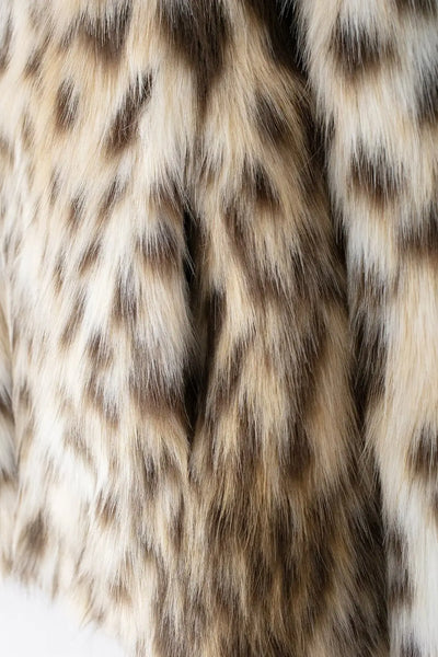 Tabitha Leopard Print Faux Fur Coat - warm, lined jacket with a lapel collar and long sleeves. Front pockets. Faux fur in cream, beige and white with distinction marks and speckle detail. Straight hem. 