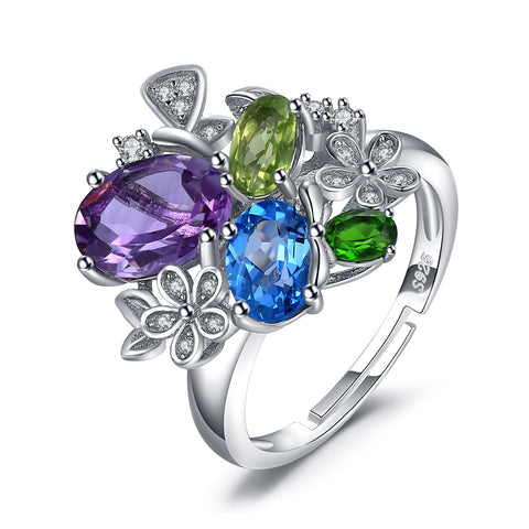 The Flower Burst Gem Ring has natural amethyst, blue topaz peridot chrome diopside ring. This dazzling one open adjustable size in 925 sterling silver. A real showpiece.