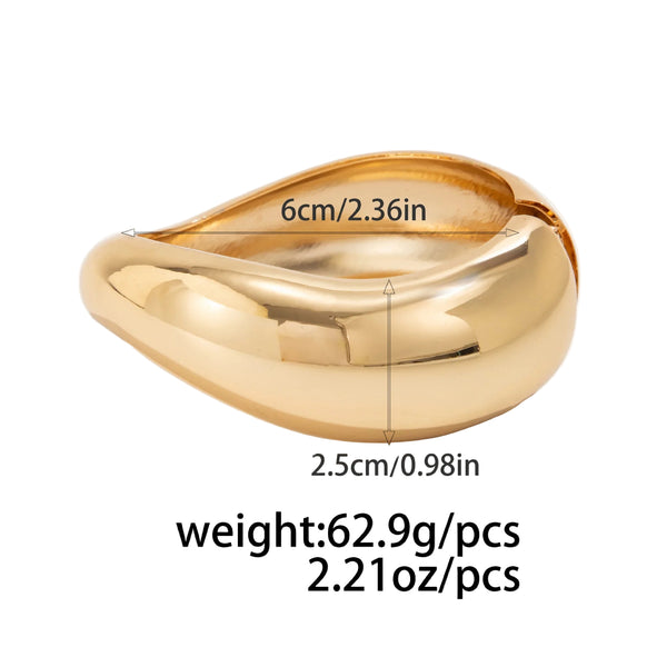 Silver, Orange, Light Blue, Gold and Clear Geometric Bangle perfect for making a statement. The design features a unique geometric shape. Constructed from high-quality resin &amp; zinc alloy that is lightweight and durable