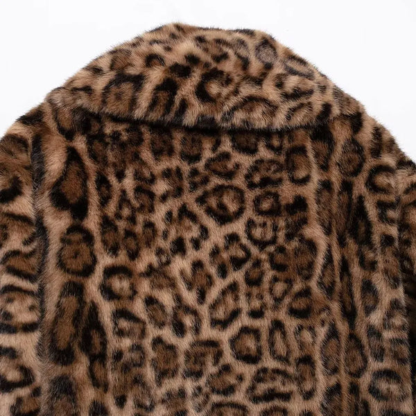 Henna Cropped Leopard Faux Fur Jacket in chocolate brown and tan. Warm, lined jacket with a lapel collar and long sleeves. Faux fur with distinction animal print and speckle detail.