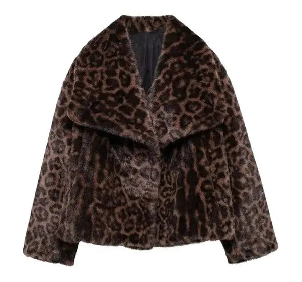 Henna Cropped Leopard Faux Fur Jacket in chocolate brown and tan. Warm, lined jacket with a lapel collar and long sleeves. Faux fur with distinction animal print and speckle detail.