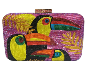The Crystal Bird Clutch Purse is an mmbellished toucan parot clutch purse, covered with tiny colored crystal rhinestones. Finished with detail clasp closure.