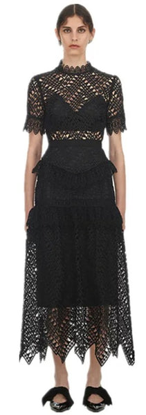 Mana Dress textured lace. Short sleeves front neckline framed with lace mandarin collar. The lined skirt has features a hand-cut, raw lace zig zag scallop hemline.