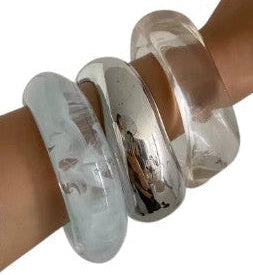 Silver, Orange, Light Blue, Gold and Clear Geometric Bangle perfect for making a statement. The design features a unique geometric shape. Constructed from high-quality resin & zinc alloy that is lightweight and durable. 