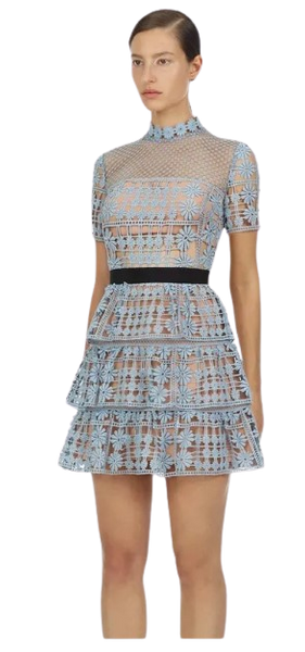 Sweet Briar Little Blue Dress is fully lined with a black ribbon waistband. The dress which is floral embroidered lace, has a mini A-line skirt with three layered frills