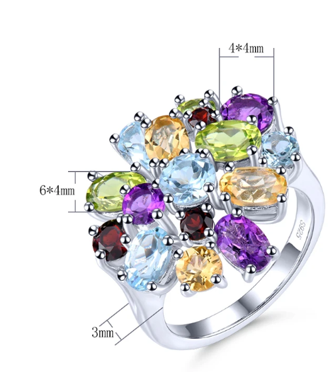 The Dream Gem Ring is a delightful multi colored gemstone silver cluster ring. It includes a halo of blue topaz, green peridot, garnet, yellow citrine and amethyst. 