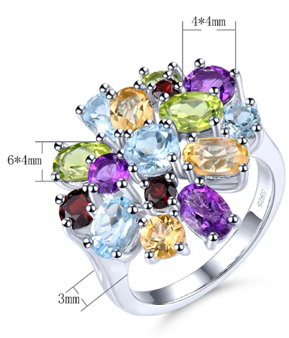 The Dream Gem Ring is a delightful multi colored gemstone silver cluster ring. It includes a halo of blue topaz, green peridot, garnet, yellow citrine and amethyst. 