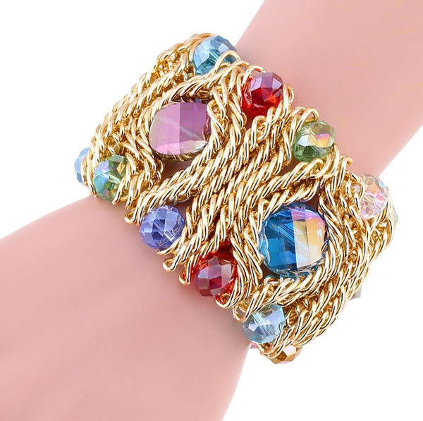 Treasure Cocktail Cuff Bracelet features elastic, soft, lightly woven alloy. It is encrusted with tiny multicolored crystal glass beads. A bohemian statement charm bracelet. 