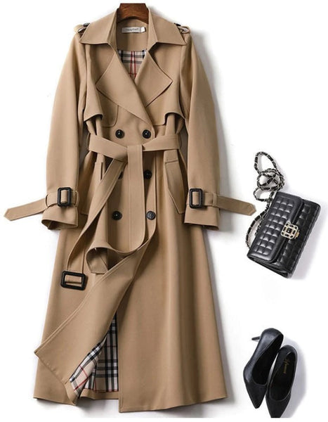 Jana Trench Coat is beautifully cut and lined. The trench is double breasted, mid-length with tortoise shell buttons and belt.
