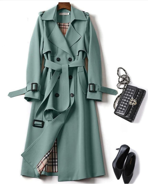 Jana Trench Coat is beautifully cut and lined. The trench is double breasted, mid-length with tortoise shell buttons and belt. In Stone, Black, Camel, Red, Teal, Green.